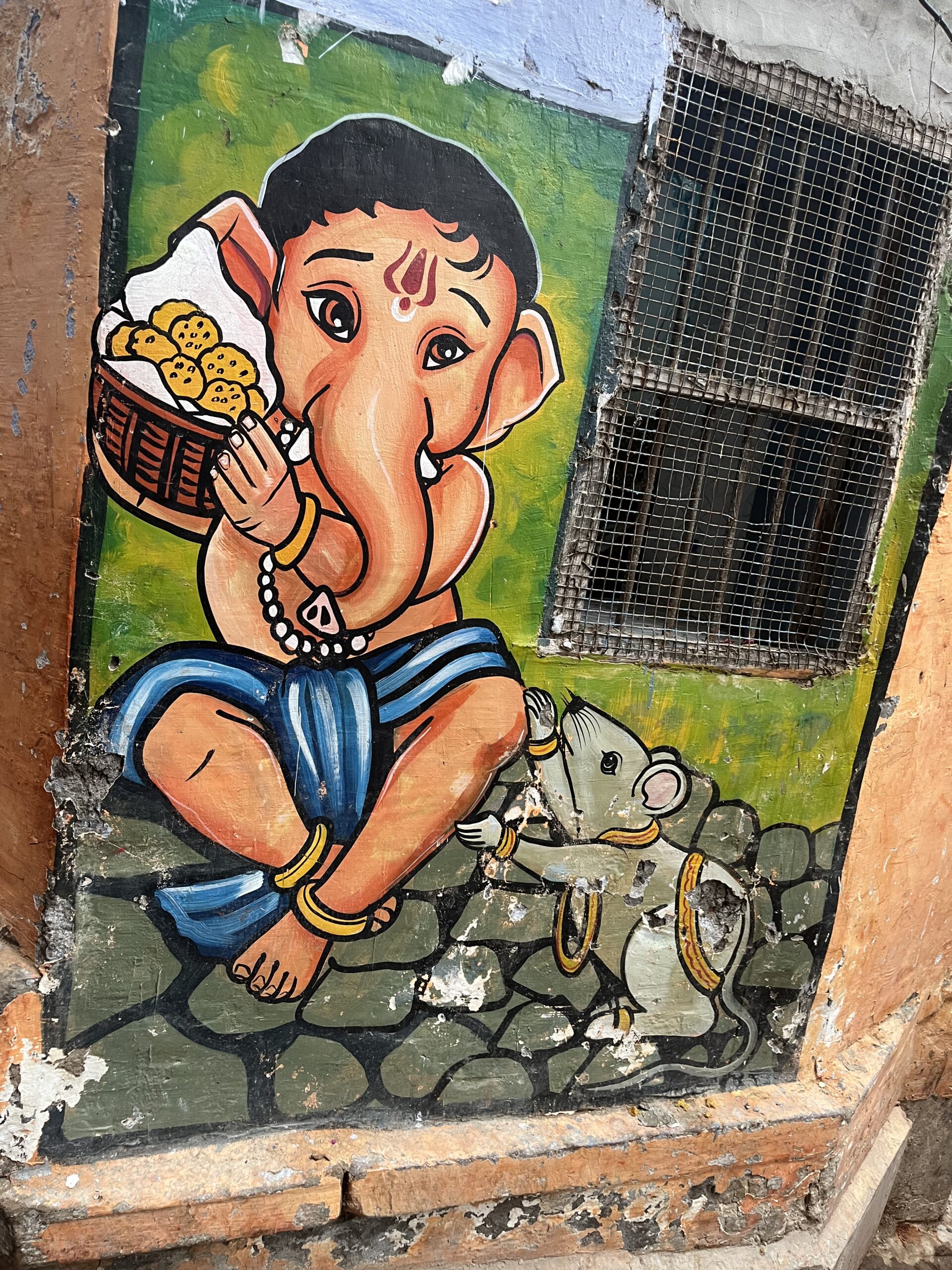 Colorful Ganesha wall art in India, symbolising spiritual wisdom, energy, and Hindu philosophy